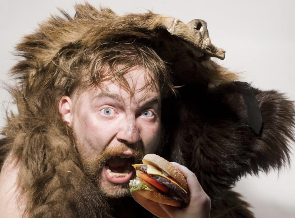 angry man eating a burger