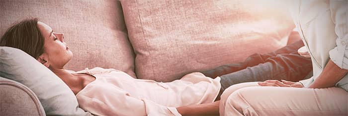 woman lying down on a couch