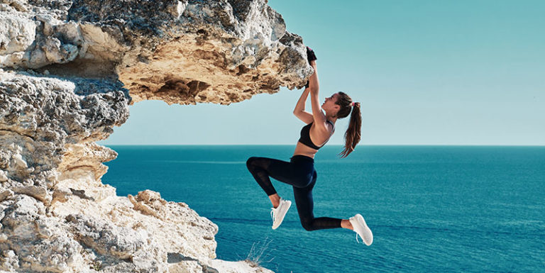 Woman rock climbing